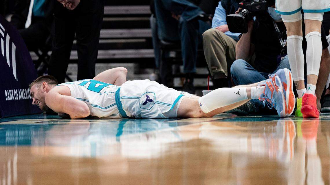 Charlotte Hornets forward Gordon Hayward is shaken up after a play during the first half of an NBA basketball game against the Toronto Raptors in Charlotte, N.C., Monday, Feb. 7, 2022. (AP Photo/Jacob Kupferman)