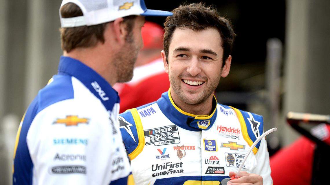 NASCAR Cup driver Chase Elliott, right, talks with his crew chief Alan Gustafson, left, following practice at Charlotte Motor Speedway on Friday, May 28, 2021. Elliott has been the sport’s most popular driver for three straight years and will be competing to win the Coca-Cola 600 Sunday.