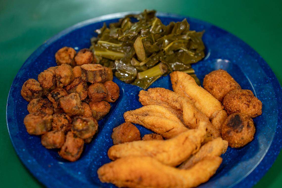 The Perch Platter with fried okra, collards and hush puppies at Circle G Restaurant.