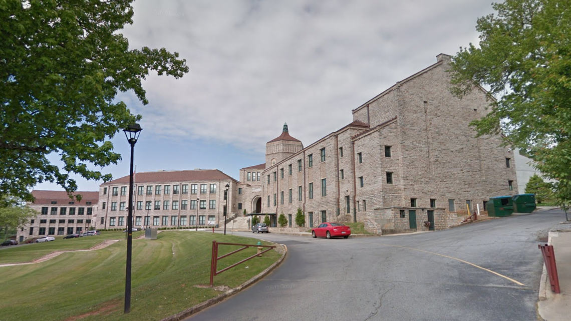 A cafeteria fight at a North Carolina high school ended with a mom in handcuffs after she used mace on one of the students, according to the Asheville Police Department.