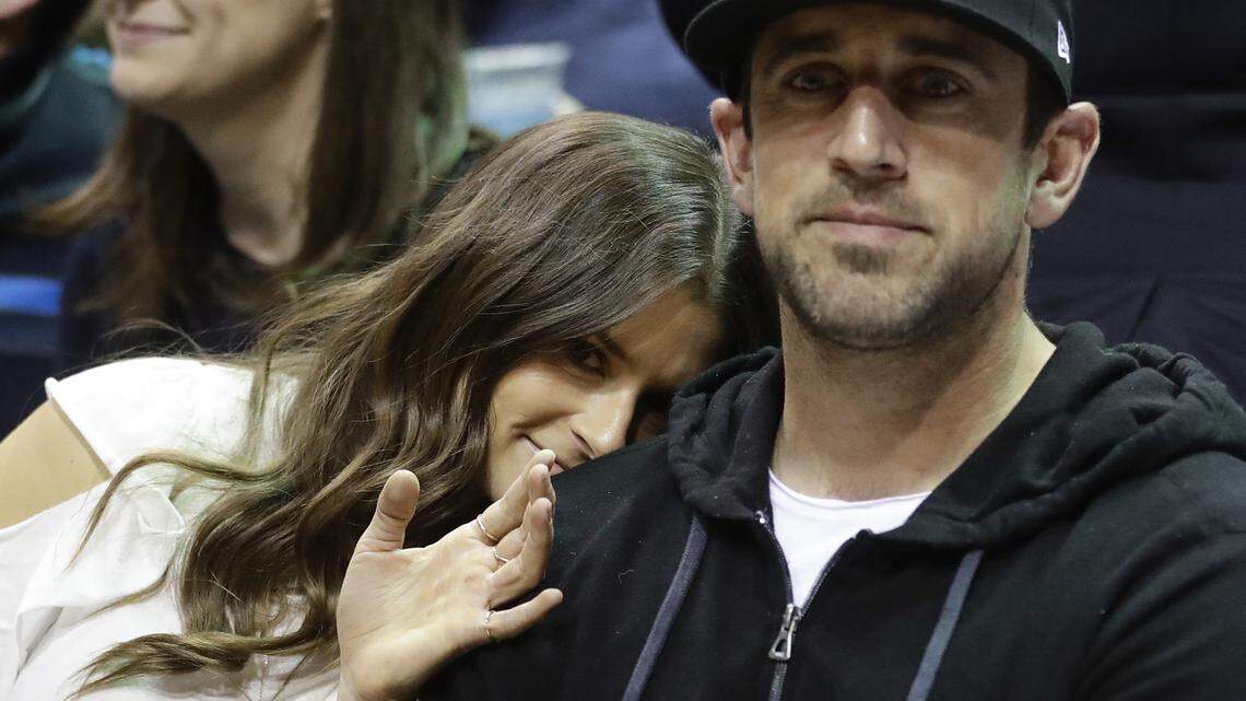 Danica Patrick and Green Bay Packers' Aaron Rodgers watch during the first half of Game 3 of an NBA basketball first-round playoff series between the Milwaukee Bucks and the Boston Celtics on Friday, April 20, 2018, in Milwaukee.