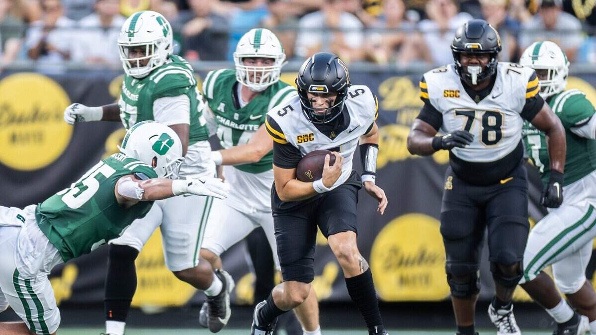 Appalachian State Mountaineers quarterback AJ Swann runs the ball against the Charlotte 49ers during the Duke's Mayo Classic at the Bank of America Stadium in Charlotte, N.C., on Friday, August 29, 2025.