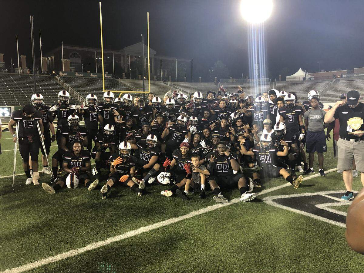 Mallard Creek’s Mavericks celebrate after their 20-7 win over rival Vance at UNC Charlotte Saturday.