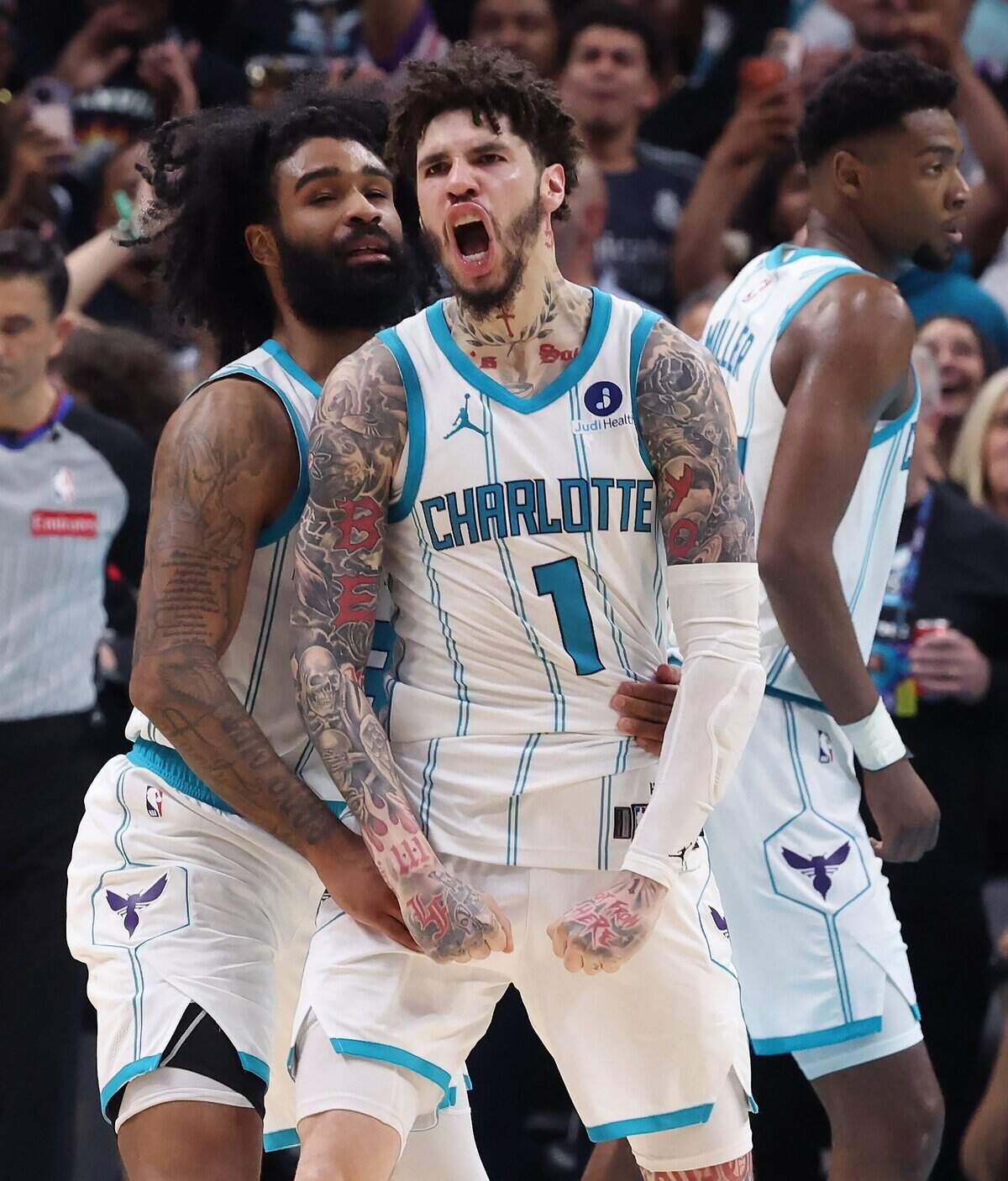 Charlotte Hornets guard LaMelo Ball, right, celebrates a basket with guard Coby White, left, during action against the Miami Heat at Spectrum Center in Charlotte, NC on Tuesday, April 14, 2026. The Hornets defeated the Heat 127-126 in NBA Play-in-Tournament basketball game.