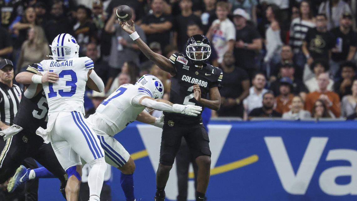 Dec 28, 2024; San Antonio, TX, USA; Colorado Buffaloes quarterback Shedeur Sanders (2) attempts a pass as Brigham Young Cougars linebacker Jack Kelly (17) defends during the second quarter at Alamodome. Mandatory Credit: Troy Taormina-Imagn Images