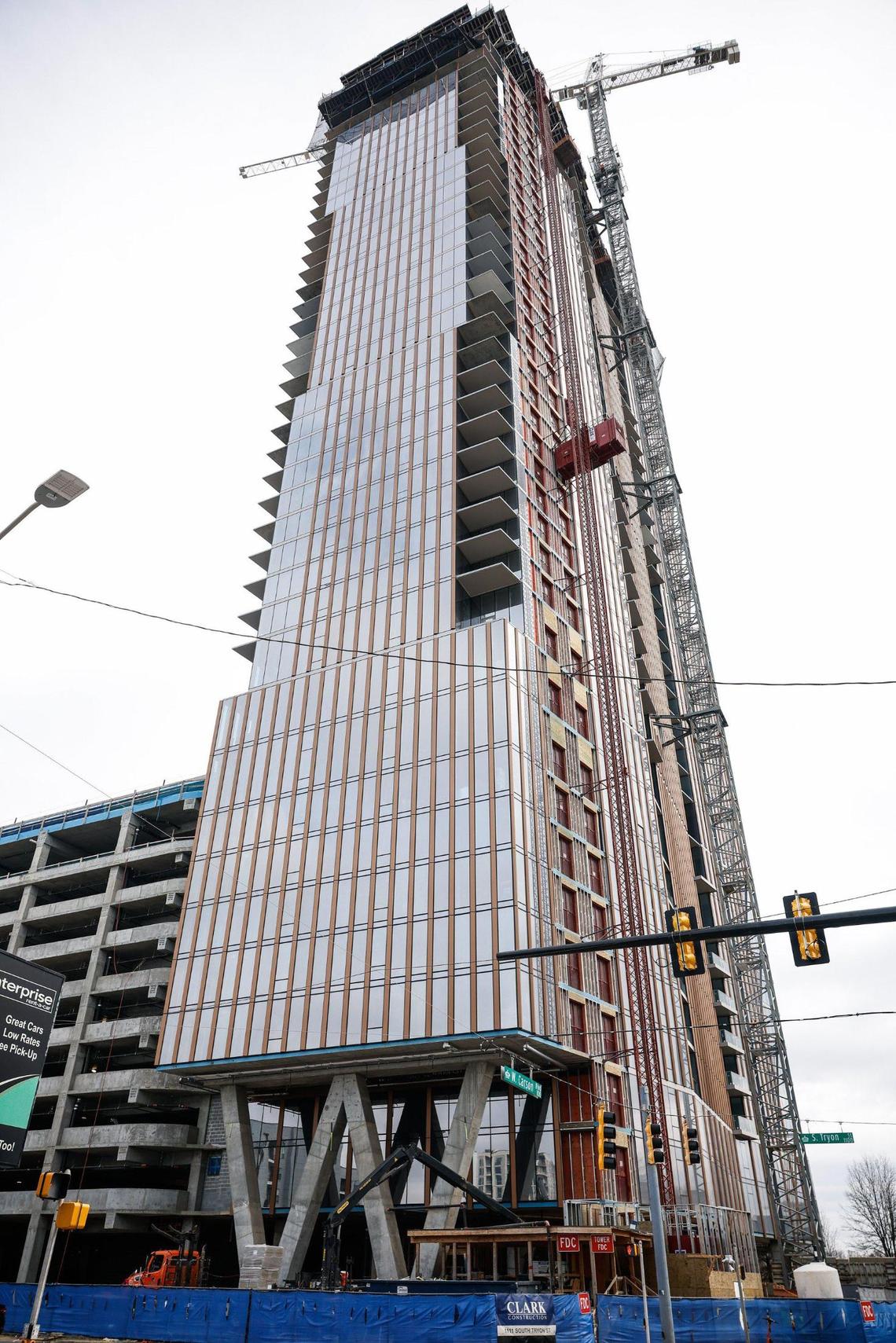 Construction on the first phase of the Queensbridge Collective project continues. This 42-story tower is the second tallest residential building in the Carolinas and will have about 409 apartments. Charlotte-based Night Swim Coffee will be a tenant on the ground floor.