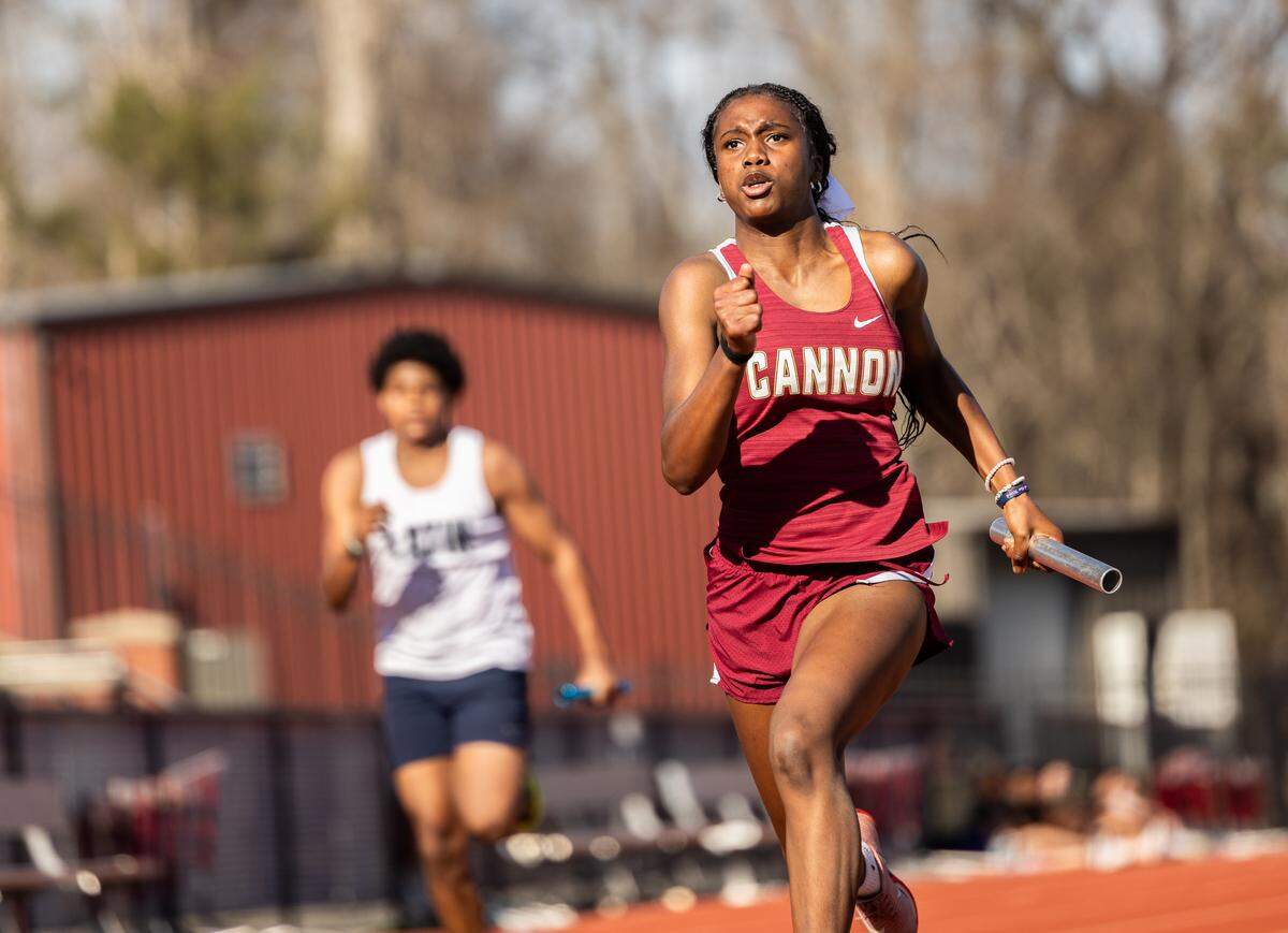 Christina Hall runs the anchor leg of the 4x100-meter relay for Cannon’s middle-school team in March. Note the male competitor — several steps behind her.