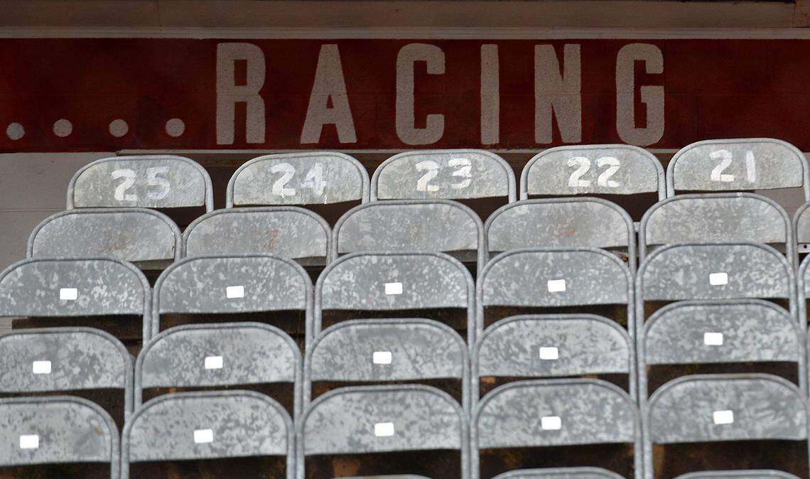 Old metal seats line the front stretch at North Wilkesboro Speedway in North Wilkesboro, NC on Thursday, October 7, 2021. North Wilkesboro Speedway was a NASCAR short track. The track operated from 1949 until 1996.