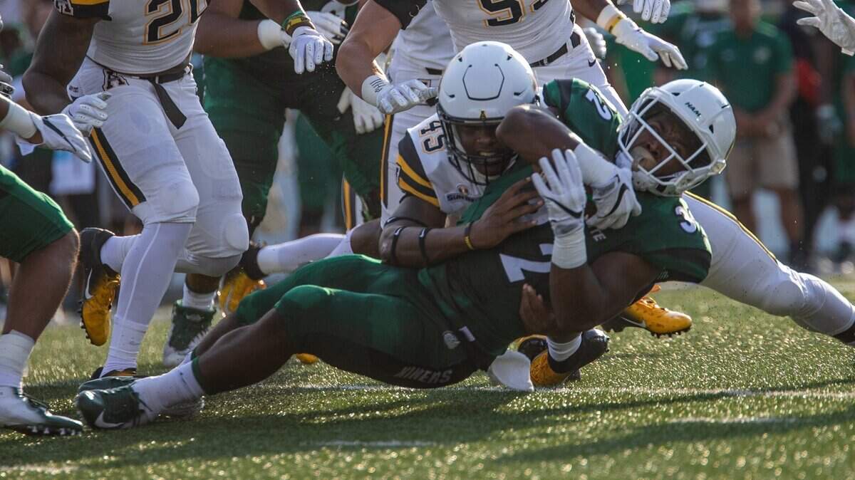 Charlotte’s Benny LeMay (32) is tackled by Appalachian State’s Trey Cobb (45) in the Mountaineers’ 45-9 victory last season.