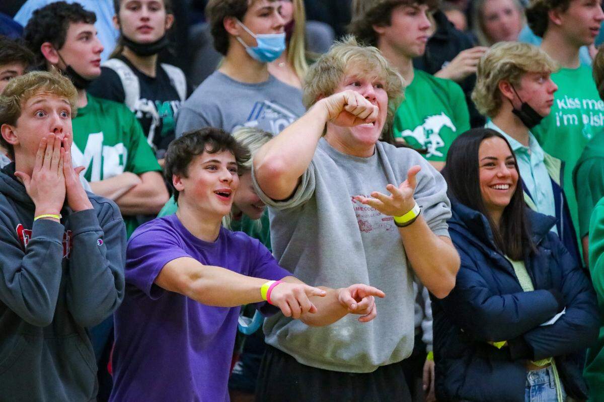 Myers Park fans cheer during Friday’s game with West Charlotte