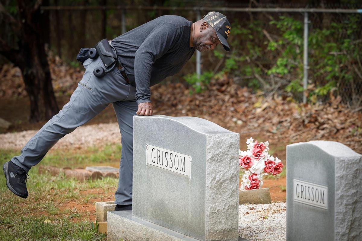 Frank Bauknight, of Mint Hill, N.C., examines headstones in Siloam Cemetery looking for distant relatives.