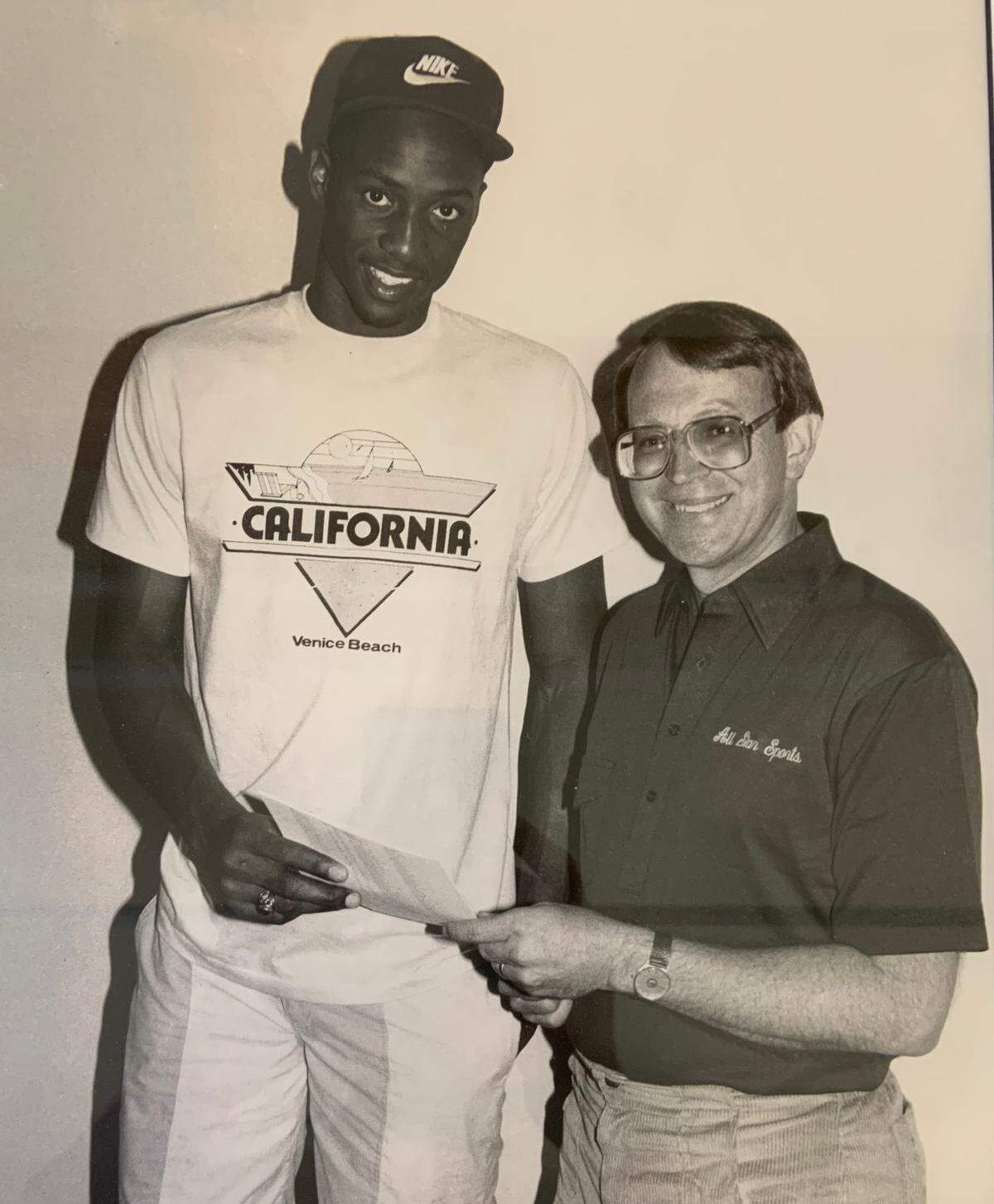 Bob Gibbons (right) with Alonzo Mourning, then a high school prep star. The photo was taken in the late 1980s. Mourning would eventually become an NBA star for the Charlotte Hornets and the Miami Heat.