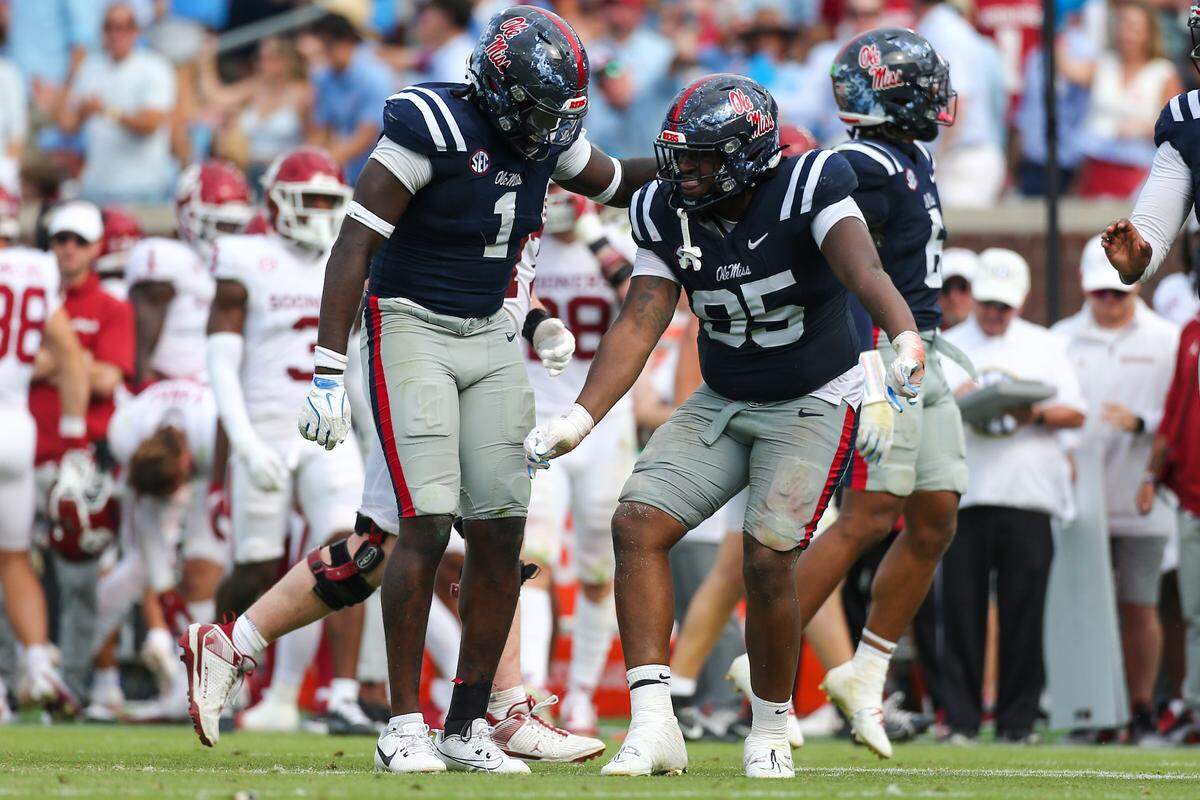 Ole Miss defensive linemen Princely Umanmielen (1) and Akelo Stone (95) reacts after a sack against the Oklahoma Sooners in a 2024 game at Vaught-Hemingway Stadium.