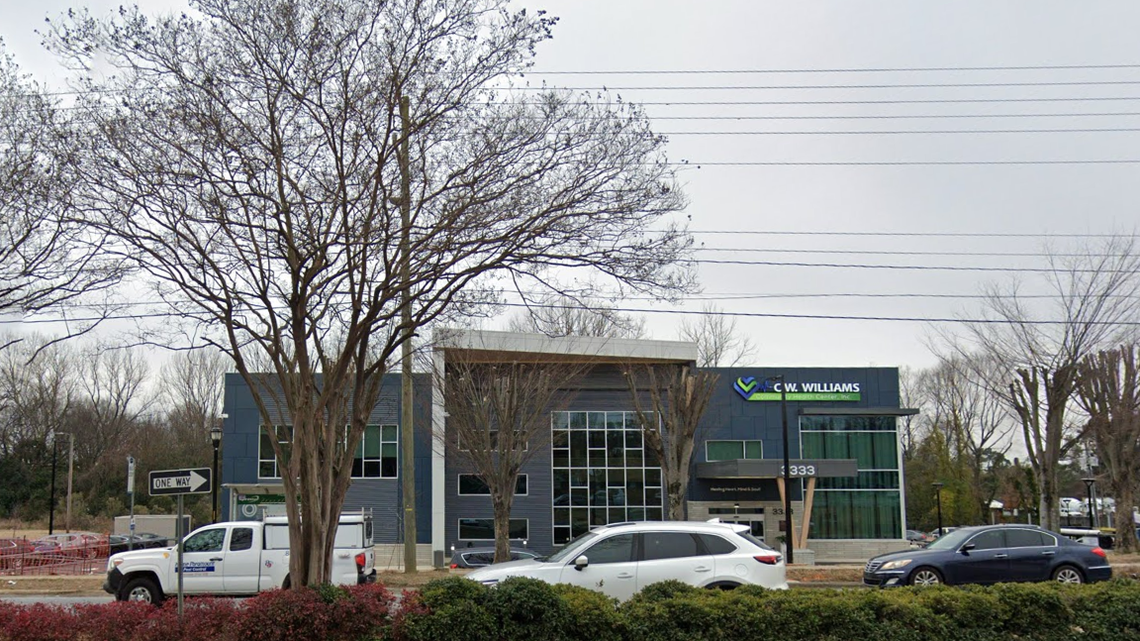 A mother was arrested after firing two shots in the air during a back-to-school event at the C.W. Williams Community Health Center on Wilkinson Boulevard on Saturday afternoon.