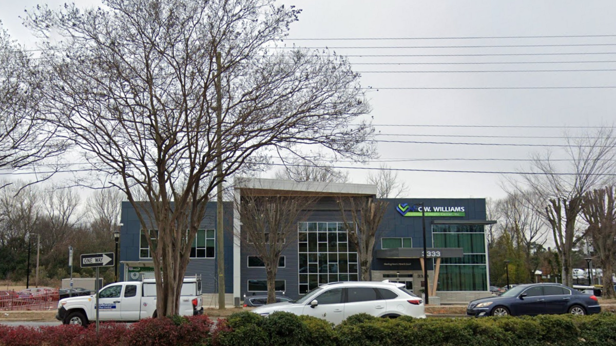 A mother was arrested after firing two shots in the air during a back-to-school event at the C.W. Williams Community Health Center on Wilkinson Boulevard on Saturday afternoon.