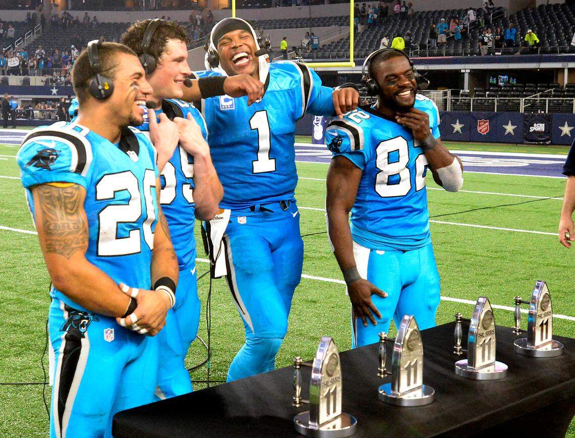 Carolina Panthers teammates Kurt Coleman (20), Luke Kuechly (59), Cam Newton (1), and Jerricho Cotchery (82) joke around while being interviewed after defeating the Dallas Cowboys 33-14 at AT&T Stadium on Thursday, November 26, 2015. The Panthers improved to 11-0 with the victory.