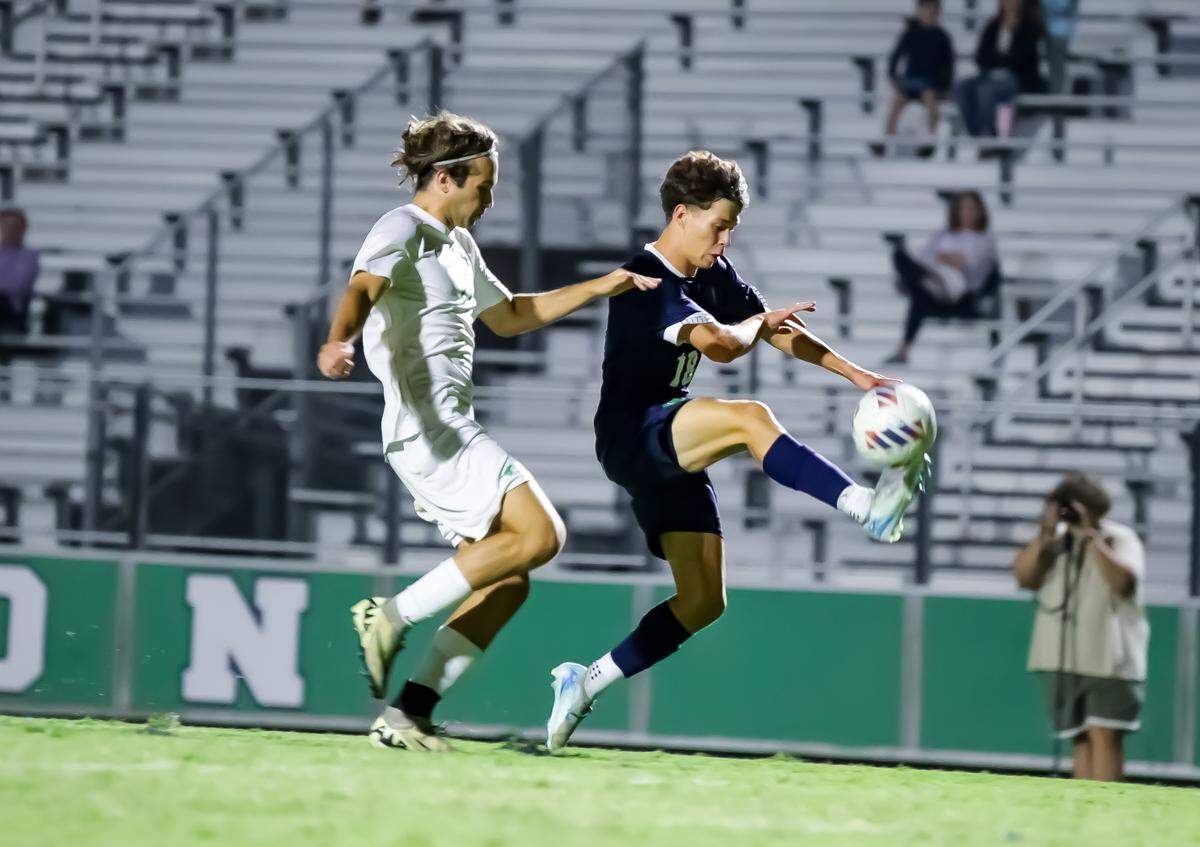 Myers Park’s Gavin Trosch (left) fights for possession of the ball with a Weddington player during the second half at Weddington high school Thursday Sep 7, 2024