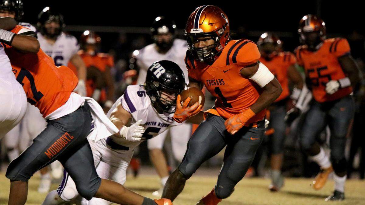 Chambers receiver KC Concepcion attempts to gain yardage against Porter Ridge Friday