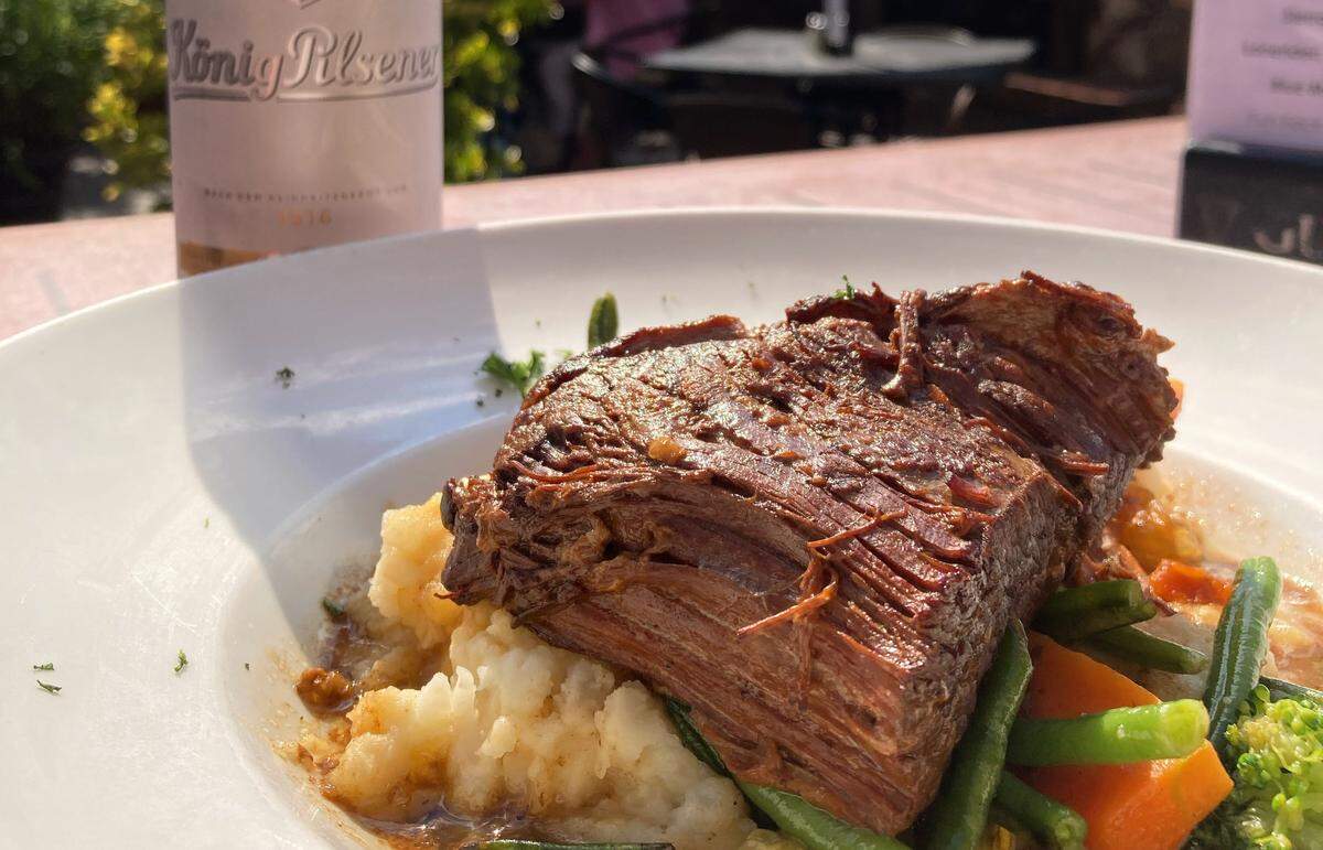Harp & Crown’s Beef Brisket Beef is braised in Guinness au jus and served with mashed potatoes, onions and seasonal vegetables.