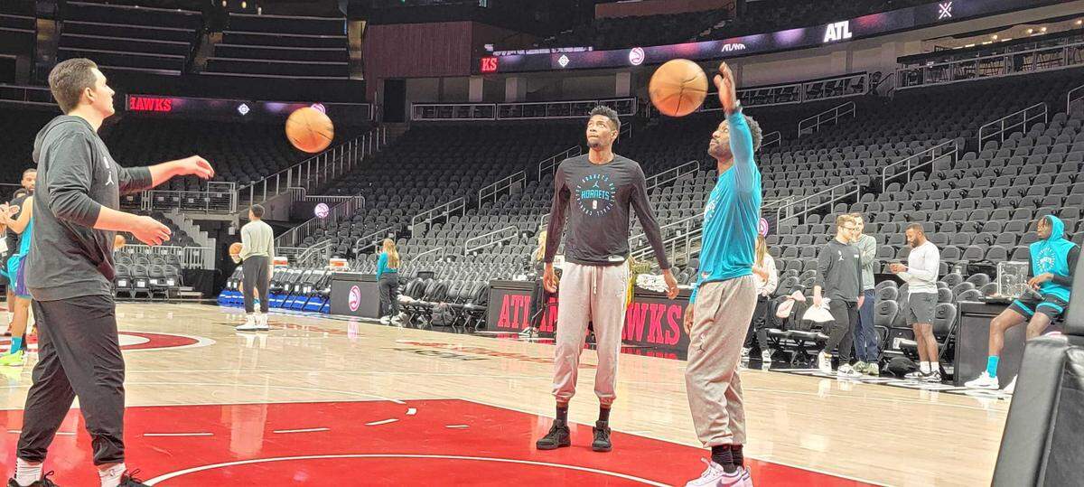 Charlotte Hornets swingman Brandon Miller watches on as teammates go through shootaround before Friday night’s game against the Atlanta Hawks at State Farm Arena.