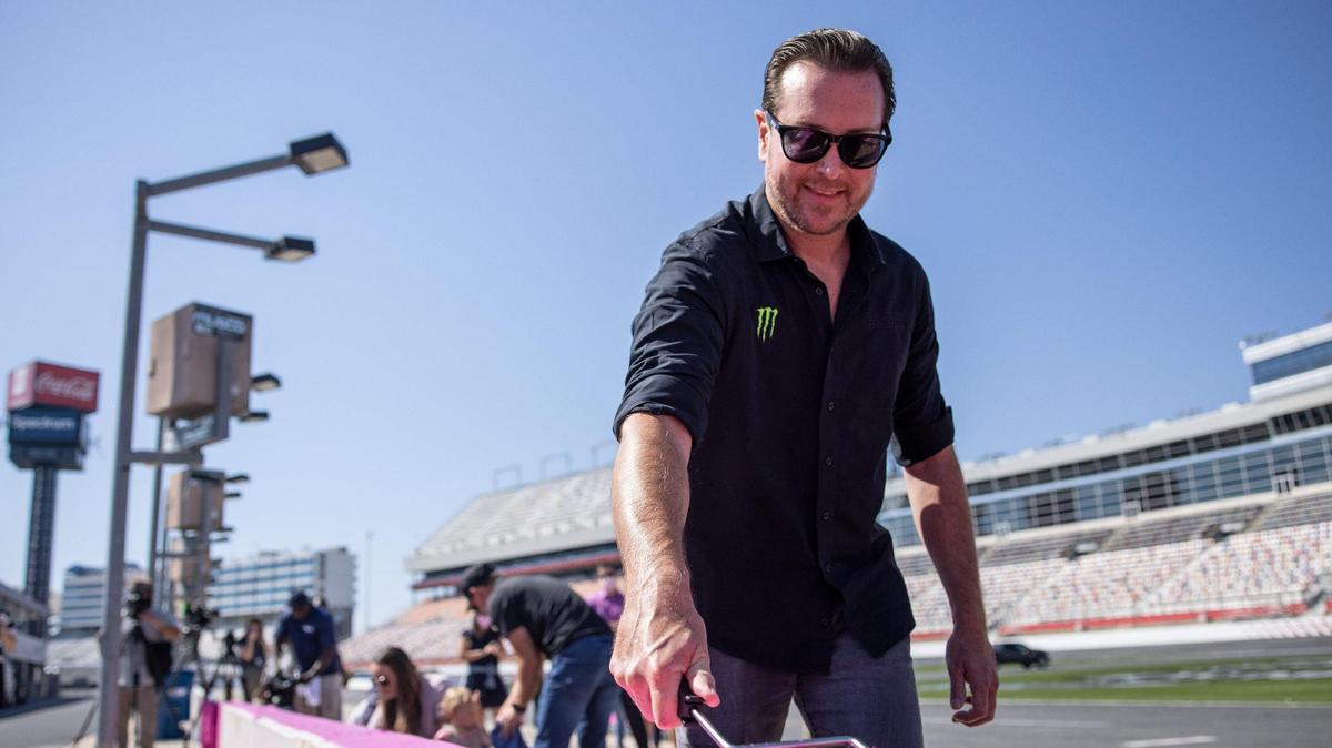 Kurt Busch paints during the Paint Pit Wall Pink event at the Charlotte Motor Speedway in Charlotte, N.C., on Tuesday, September 28, 2021.