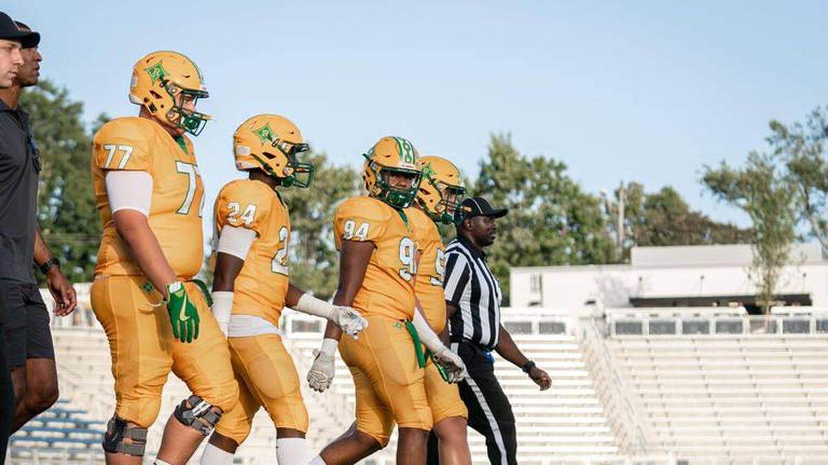 Richmond Senior captains walk to midfield for the coin toss