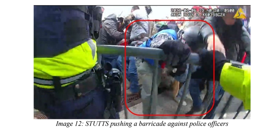 Lee Stutts of the Lake Norman area is shown pushing a barricade against police officers during the Jan. 6, 2021, Capitol riots.
