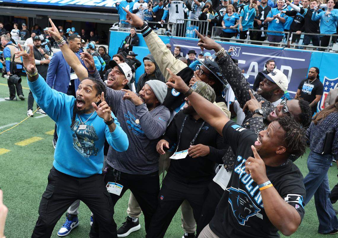 2015 Carolina Panthers team members do their signature point to the sky prior to the team’s game against the Los Angeles Rams at Bank of America Stadium on Saturday, January 10, 2026. The Rams defeated the Panthers 34-31.