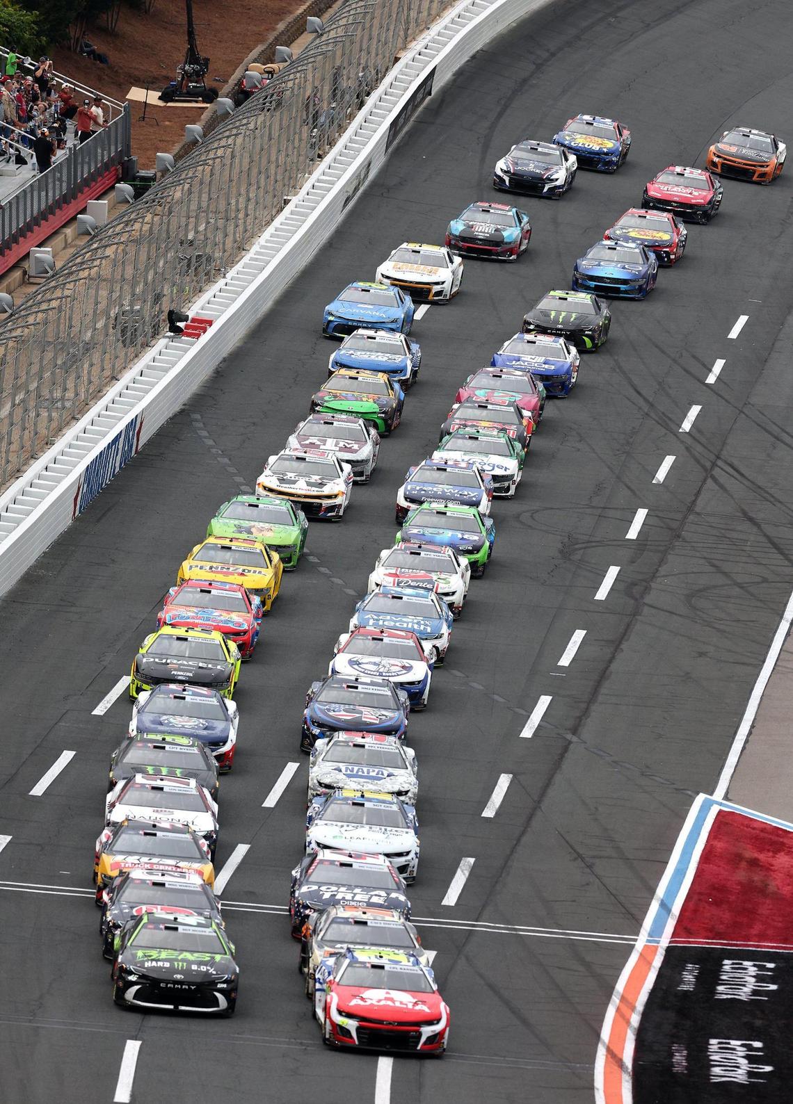 The NASCAR Cup field approach the starting line during the Coca-Cola 600 at Charlotte Motor Speedway in Concord, NC on Sunday, May 25, 2025.