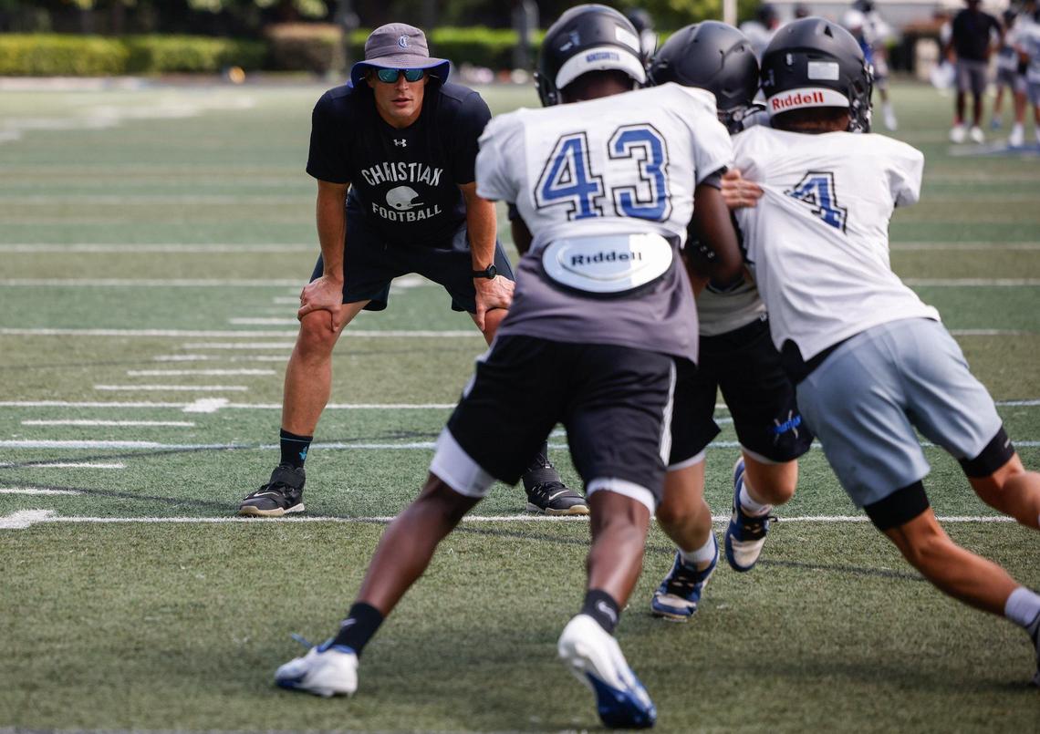 Former Carolina Panthers linebacker Luke Kuechly coaches players with Charlotte Christian middle school during football practice on Wednesday, August 22, 2024.
