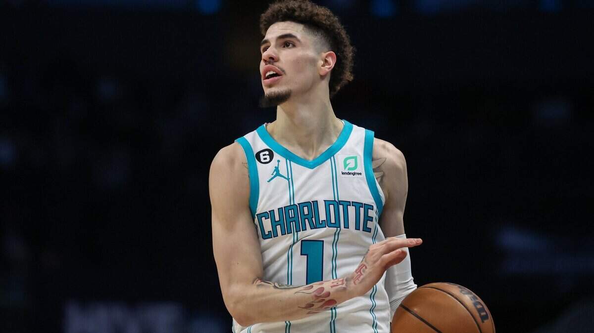 Hornets guard LaMelo Ball looks for a pass during the game against the Pistons at Spectrum Center on Wednesday, December 14, 2022. Ball had 23 points and 11 assists in the game, but Charlotte lost to Detroit, 141-134, in overtime.