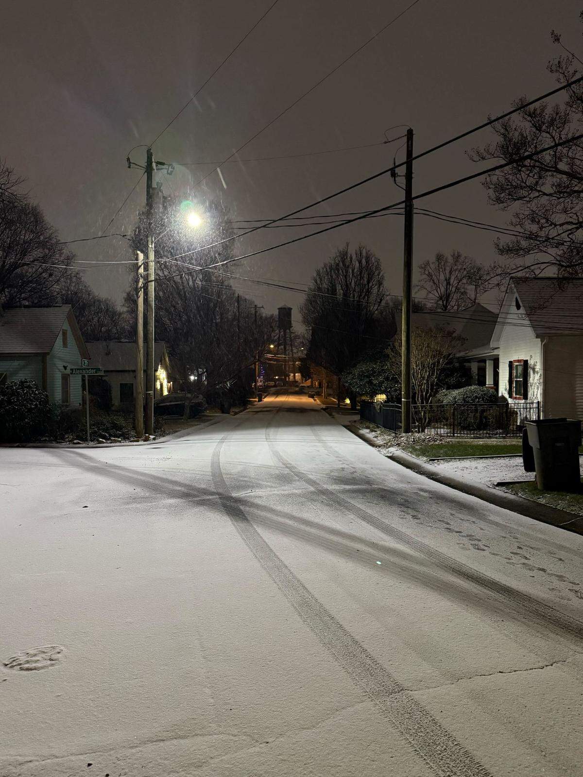 Snow fell on 37th Street in Charlotte’s NoDa neighborhood on Tuesday.