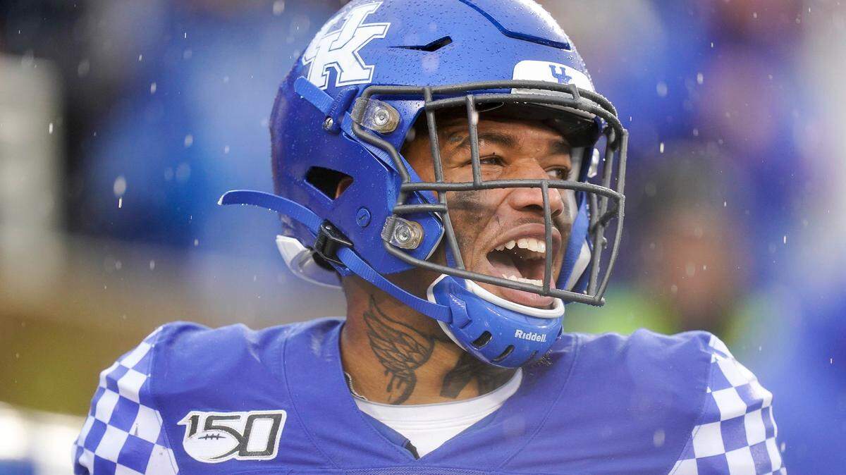 Kentucky quarterback Lynn Bowden Jr. celebrates after scoring a touchdown against Louisville. The explosive Bowden should provide plenty of entertainment for Tuesday’s Belk Bowl in Charlotte.