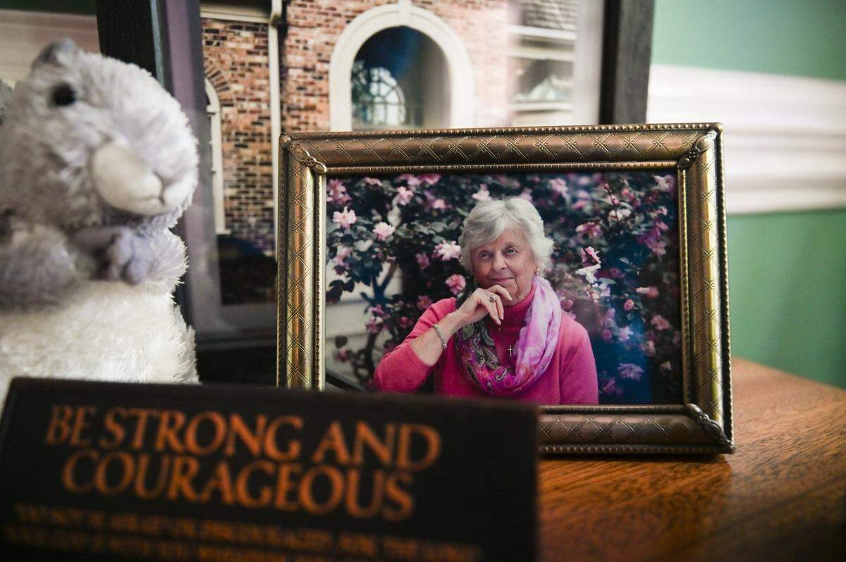 A framed photo of Jean Ford, the late wife of Leighton Ford and younger sister of Billy Graham, is displayed alongside a stuffed squirrel, a nod to an inside joke among the family, at his home in Charlotte on Tuesday, May 12, 2026.
