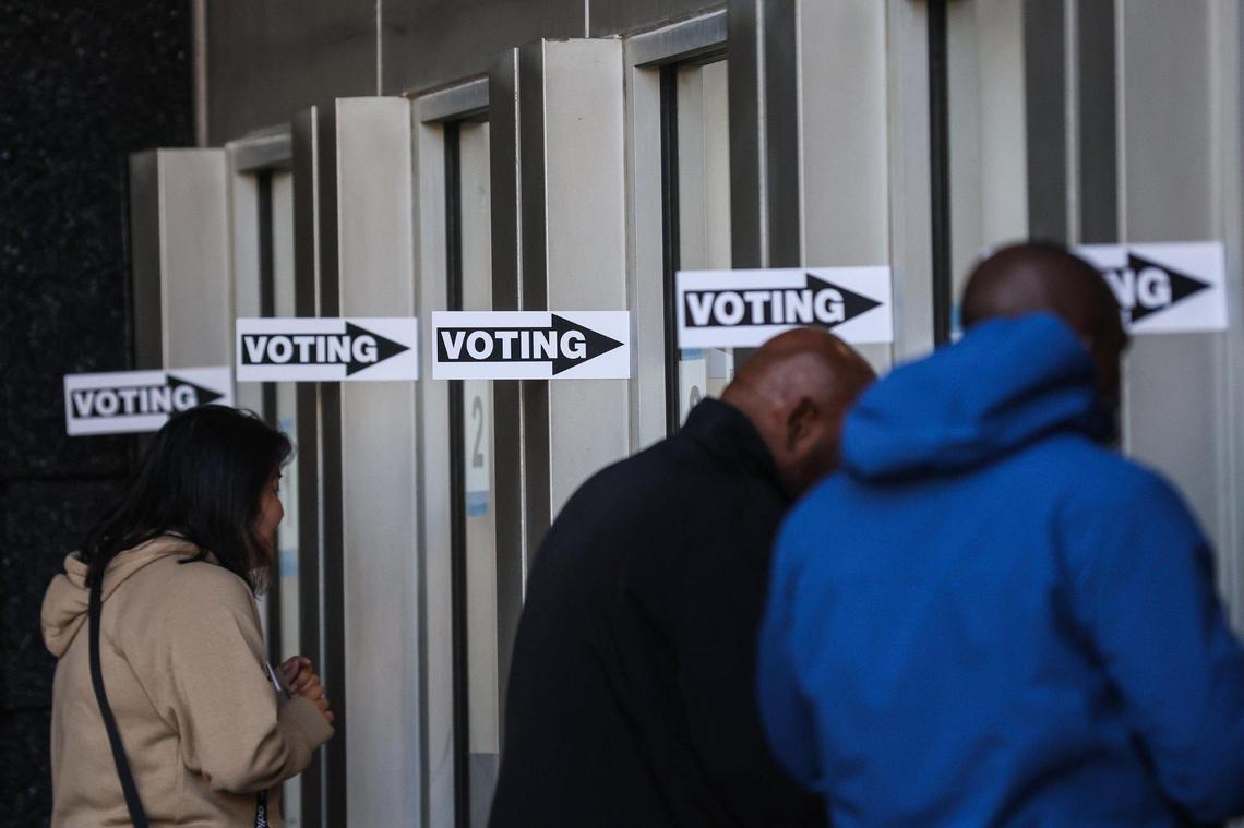 People arrive to vote early at the Bank of America Stadium voting site in Charlotte on Thursday, October, 20, 2022.