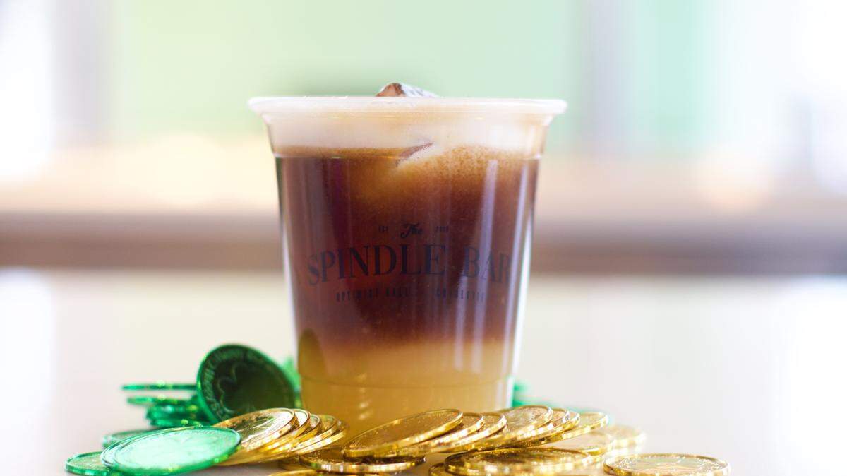 Spindle Bar’s Pot o’ Gold cocktail includes bourbon, egg white, milk stout syrup and cinnamon for $12.