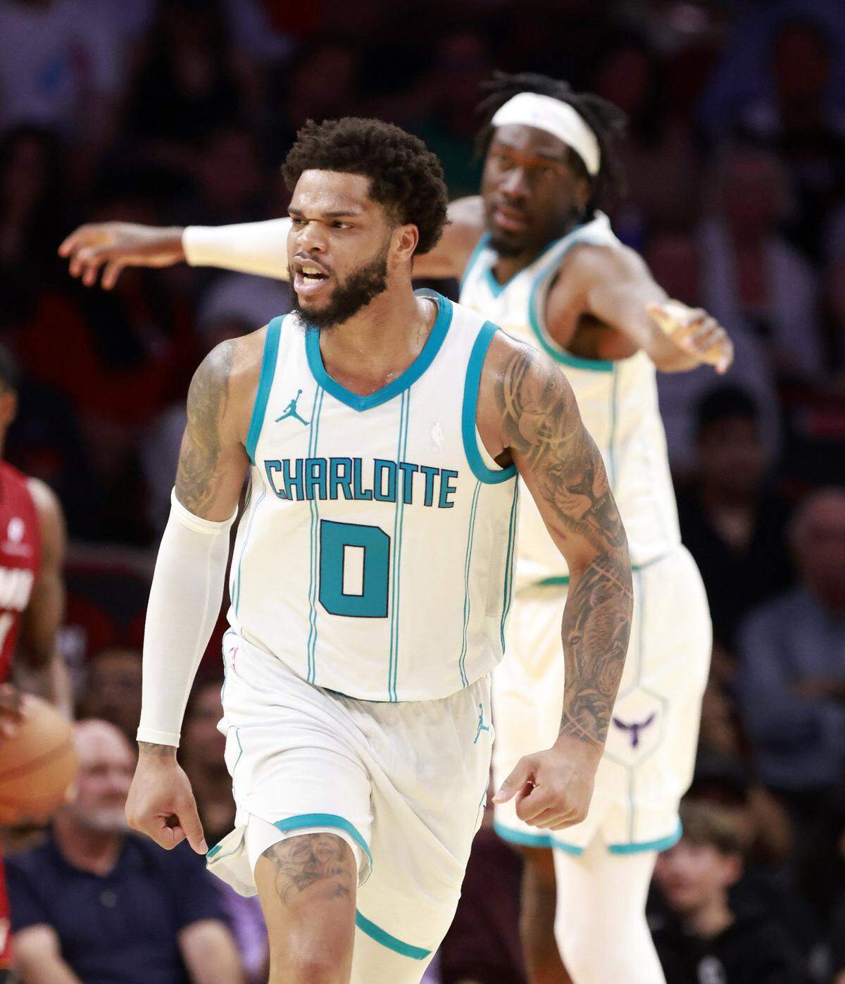 Charlotte Hornets guard Josh Green (10) reacts agsinst the during the second half at Kaseya Center.