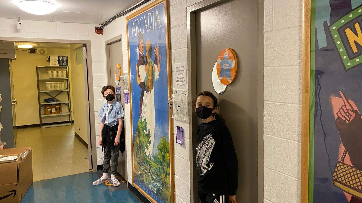 Charlotte teenager Atticus Ware and his understudy, Patrick Scott McDermott, pose backstage in front of their dressing room doors at Lincoln Center Theater.