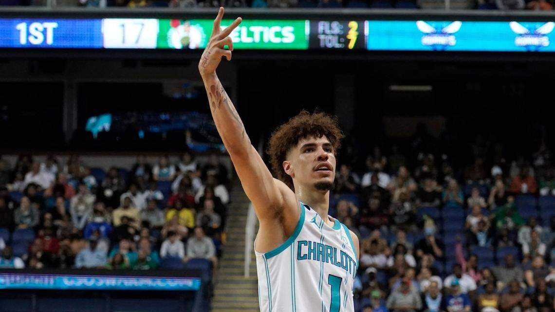 Charlotte Hornets’ LaMelo Ball (1) gestures after making a 3-point basket against the Boston Celtics during the first half of an NBA preseason basketball game in Greensboro, N.C., Friday, Oct. 7, 2022. (AP Photo/Chuck Burton)