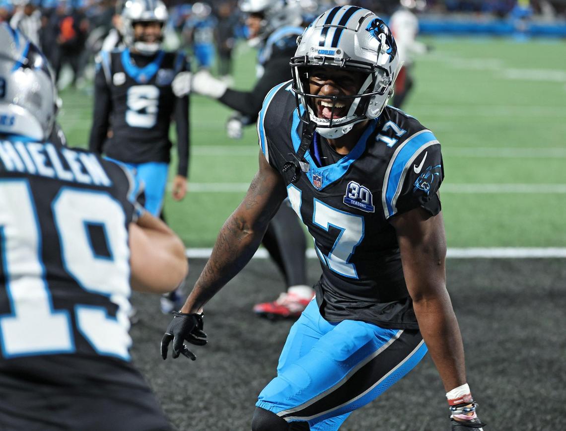 Carolina Panthers wide receiver Xavier Legette chases after wide receiver Adam Thielen, left, to continue celebrating Thielen’s touchdown pass reception from quarterback Bryce Young during action against the Tampa Bay Buccaneers at Bank of America Stadium in Charlotte, NC on Sunday, December 1, 2024. The Buccaneers would defeat the Panthers in overtime 26-23.