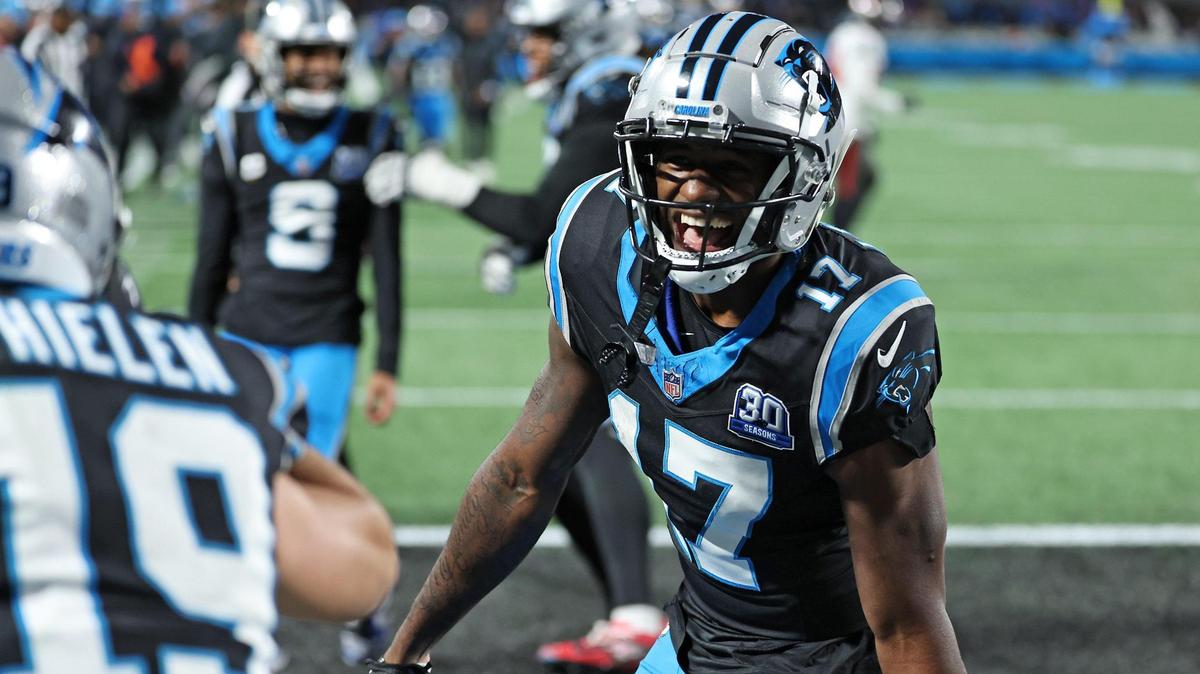 Carolina Panthers wide receiver Xavier Legette chases after wide receiver Adam Thielen, left, to continue celebrating Thielen’s touchdown pass reception from quarterback Bryce Young during action against the Tampa Bay Buccaneers at Bank of America Stadium in Charlotte, NC on Sunday, December 1, 2024. The Buccaneers would defeat the Panthers in overtime 26-23.