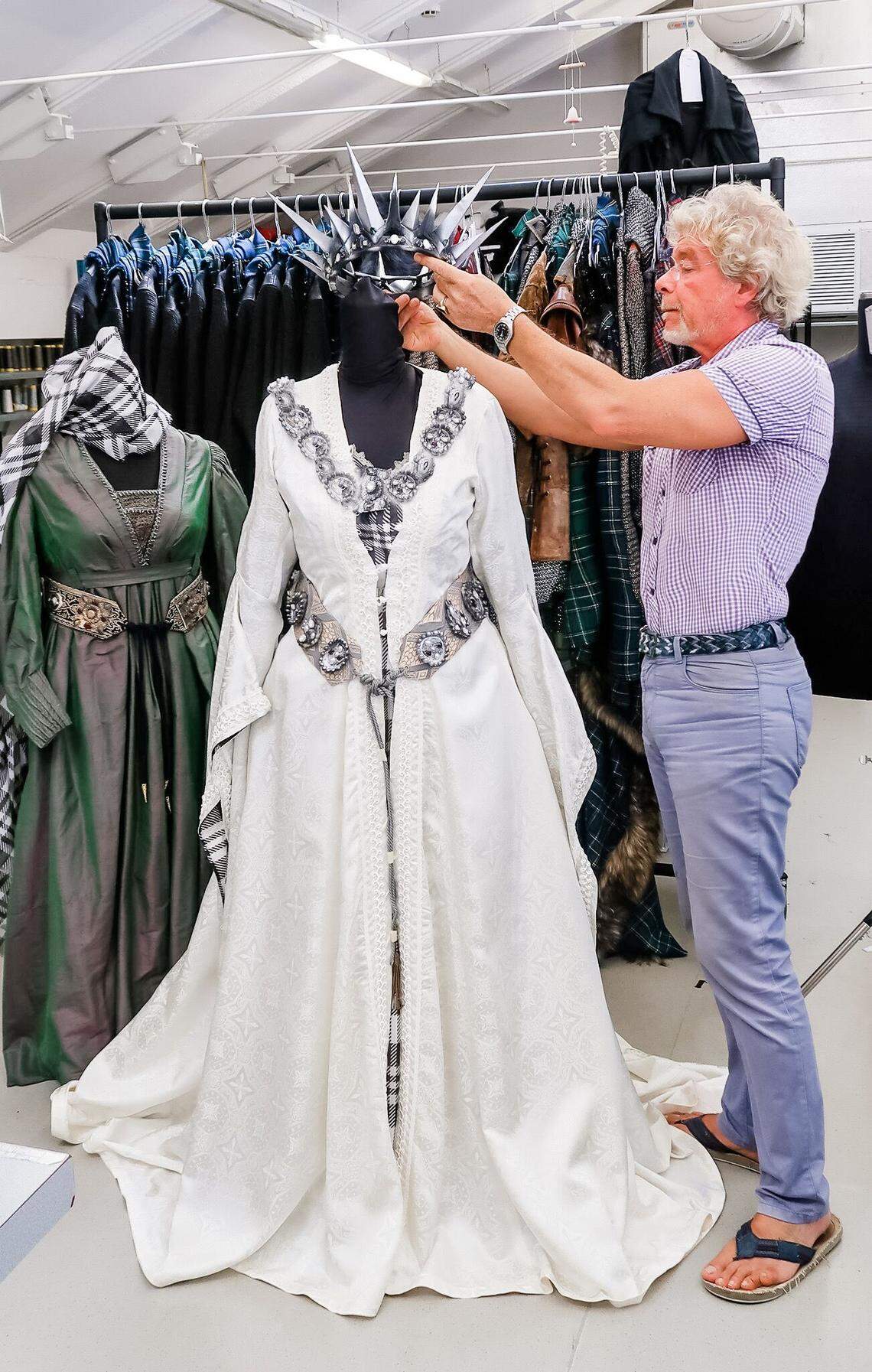 Costume maker Stefano Nicolao adjusts a crown on Lady Macbeth’s costume. Nicolao’s workshop in Venice, Italy created all of the costumes for Opera Carolina’s performance of Macbeth.