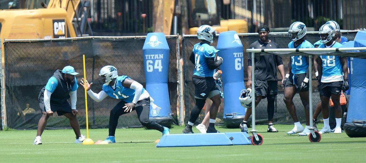 Nic Scourton (second from left), #11, a Panthers outside linebacker goes through drills during practice. The Carolina Panthers, in their second week of organized team activities, ran through drills on Tuesday, June 3, 2025 at their practice facility in uptown Charlotte.
