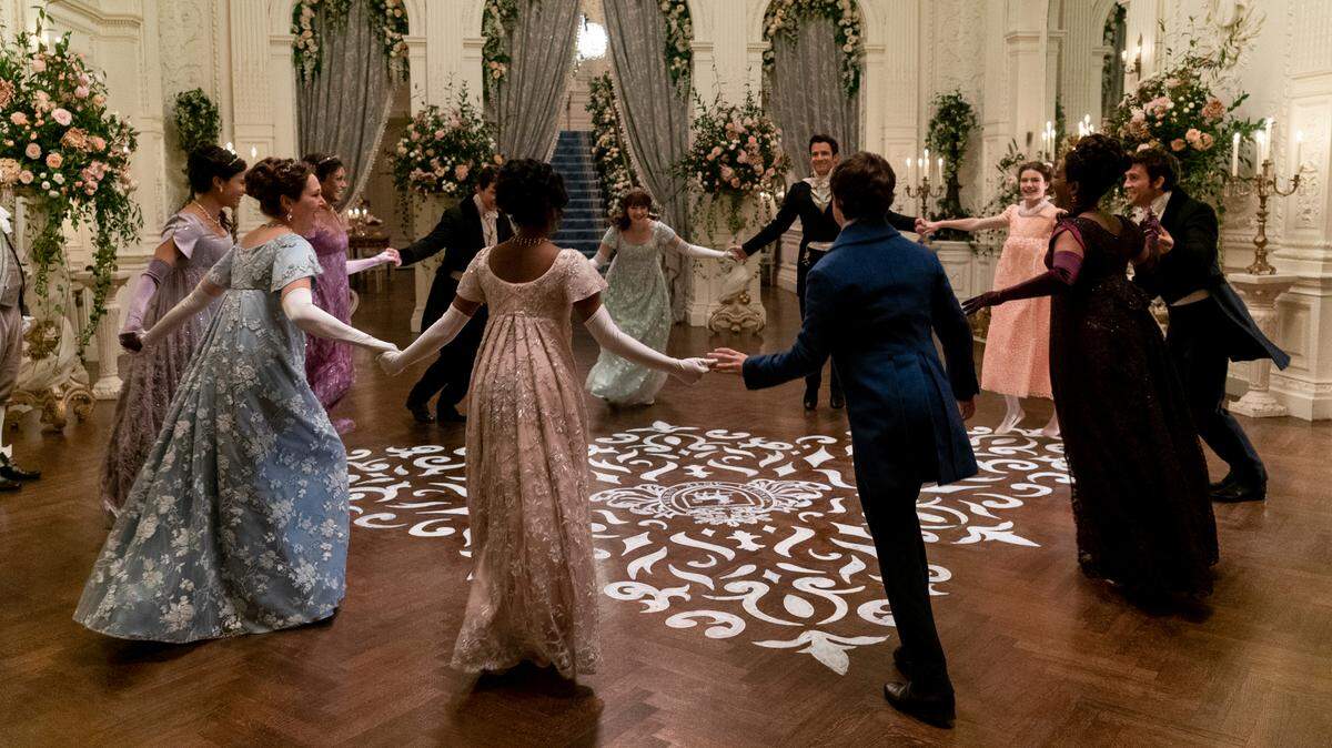 Shelley Conn, Ruth Gemmell, Simone Ashley, Luke Newton, Charithra Chandran, Claudia Jessie, Luke Thompson, Will Tilston, Florence Emilia Hunt, Adjoa Andoh and Jonathan Bailey in “Bridgerton” on Netflix.