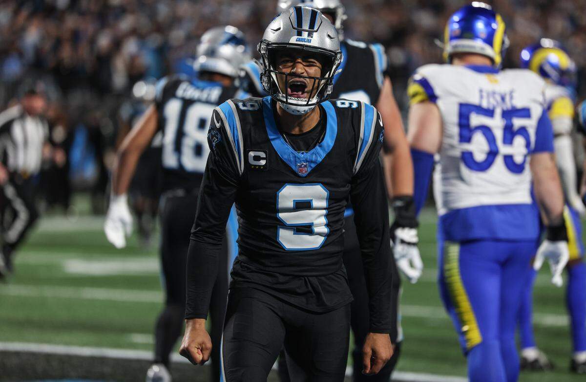 Panthers quarterback Bryce Young celebrates scoring a rushing touchdown during  the wild card playoff game against the L.A. Rams at Bank of America Stadium in Charlotte Saturday