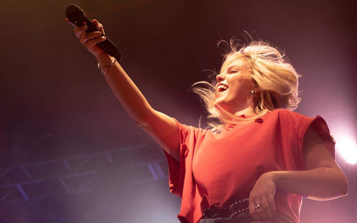 Reneé Rapp playfully encourages the crowd at The Fillmore to sing along during her concert Wednesday.