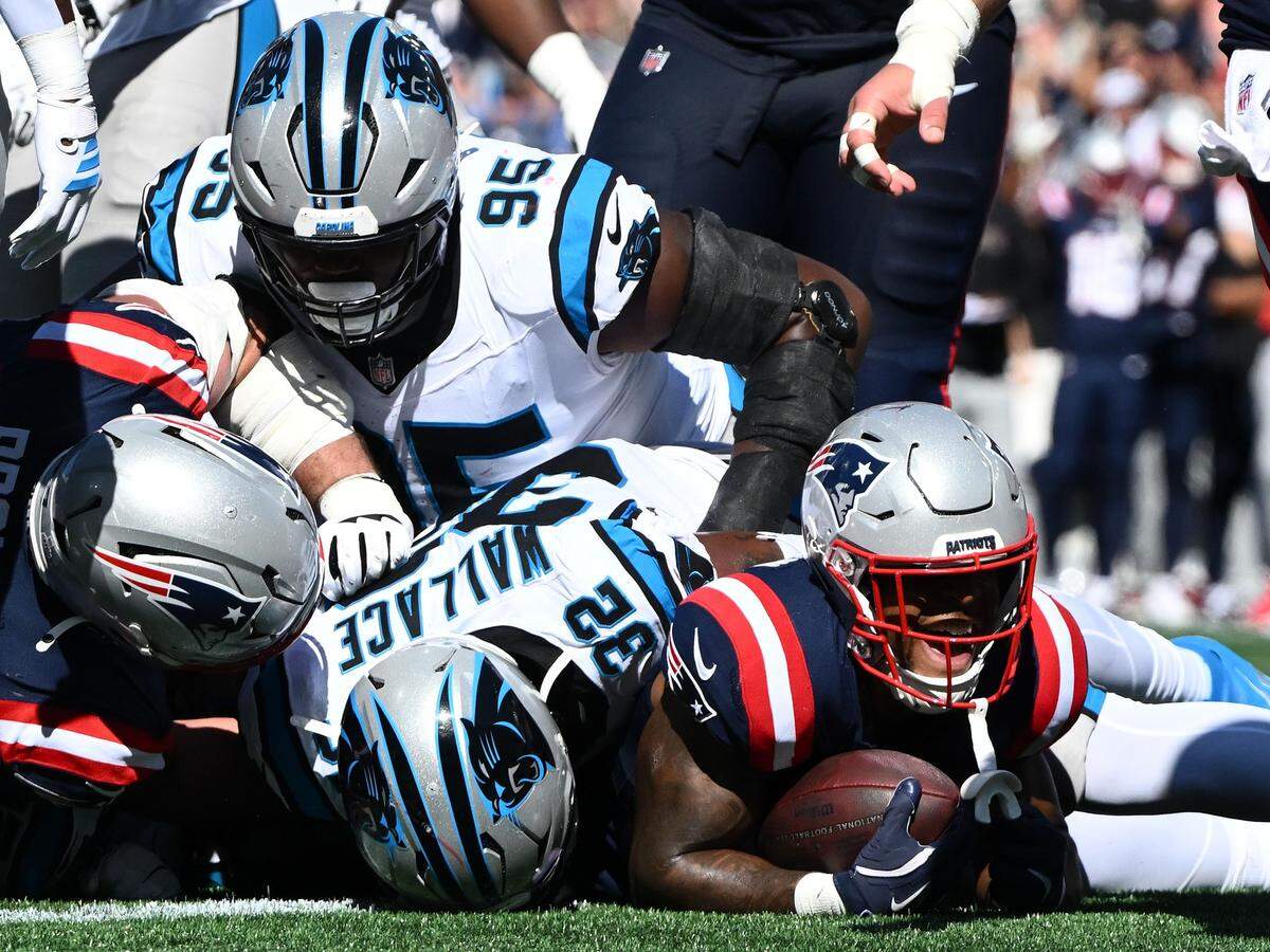New England Patriots running back Treveyon Henderson (32) scores a touchdown against the Carolina Panthers during Sunday’s first half at Gillette Stadium.