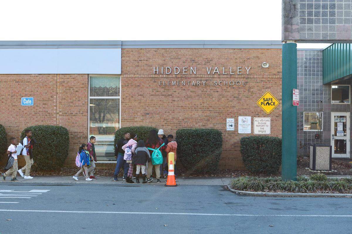 Children wait to be picked up outside Hidden Valley Elementary School on Tuesday, January 10, 2023.