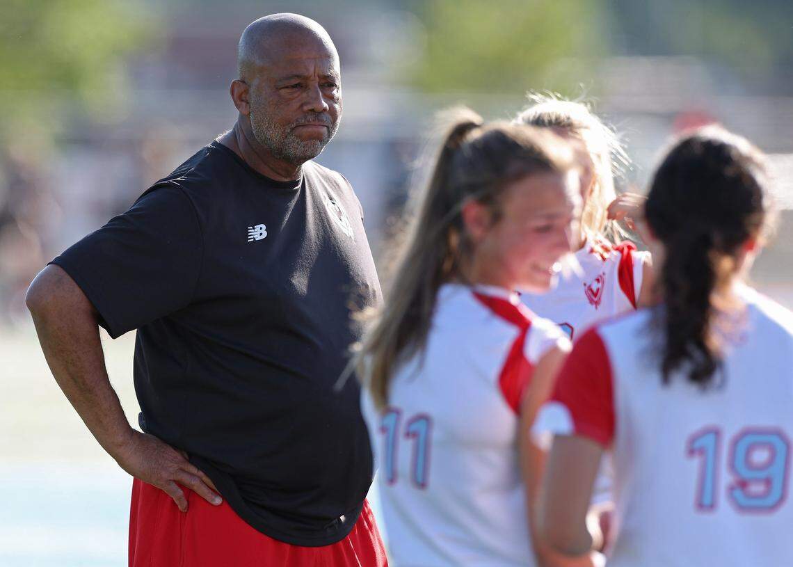 Charlotte Catholic soccer coach Gary Hoilett listens as his team prepares for action against Piedmont on April 15, 2026. Charlotte Catholic is ranked No. 4 in the nation by MaxPreps.