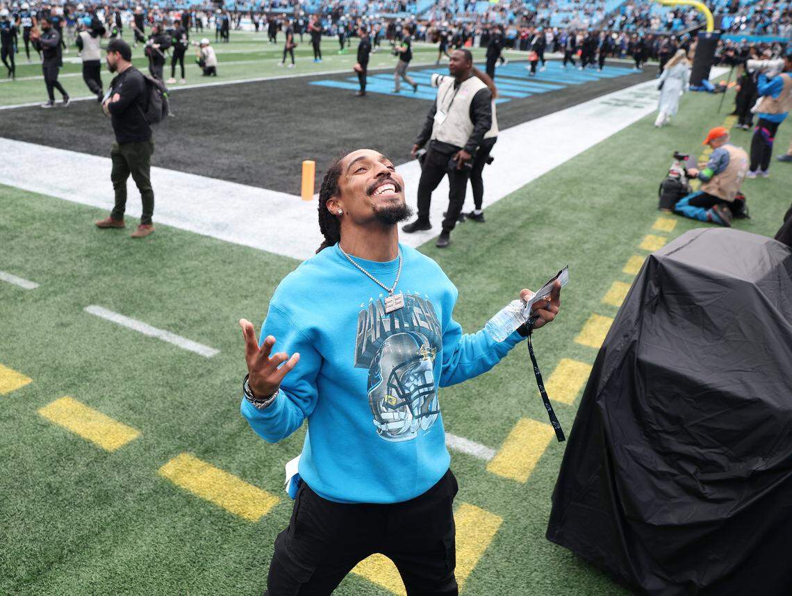 Former Carolina Panthers safety Tre Boston smiles for the fans as he walks around the field prior to the team’s game against the Los Angeles Rams at Bank of America Stadium on Saturday, January 10, 2026. The Rams defeated the Panthers 34-31.